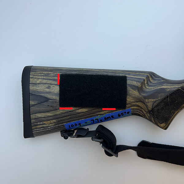 adhesive side against the stock